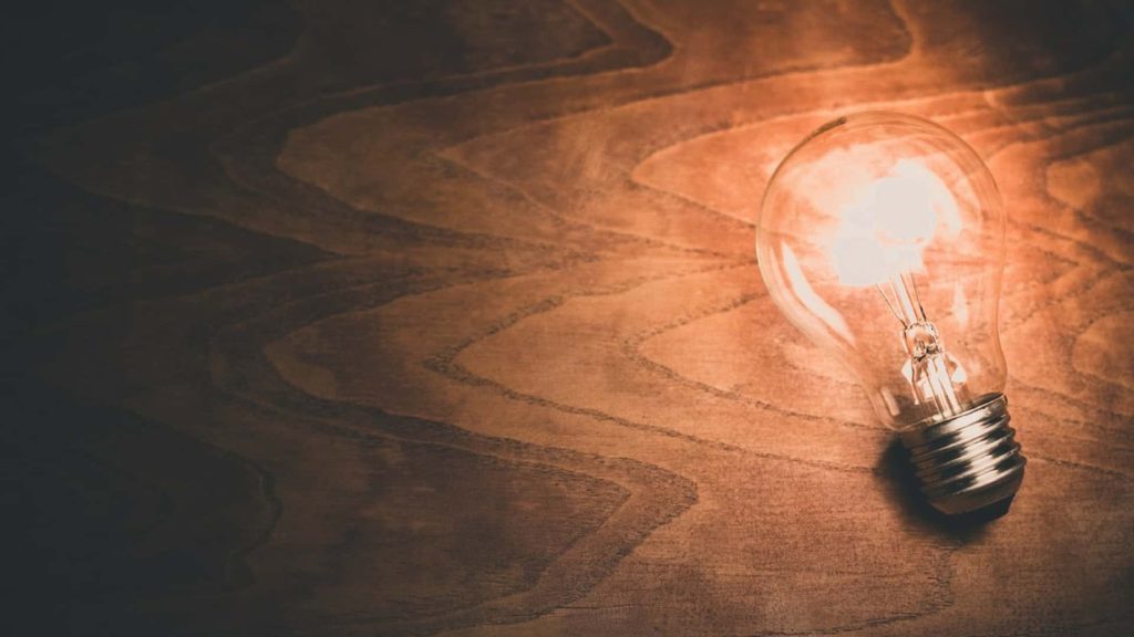 light bulb on wooden surface